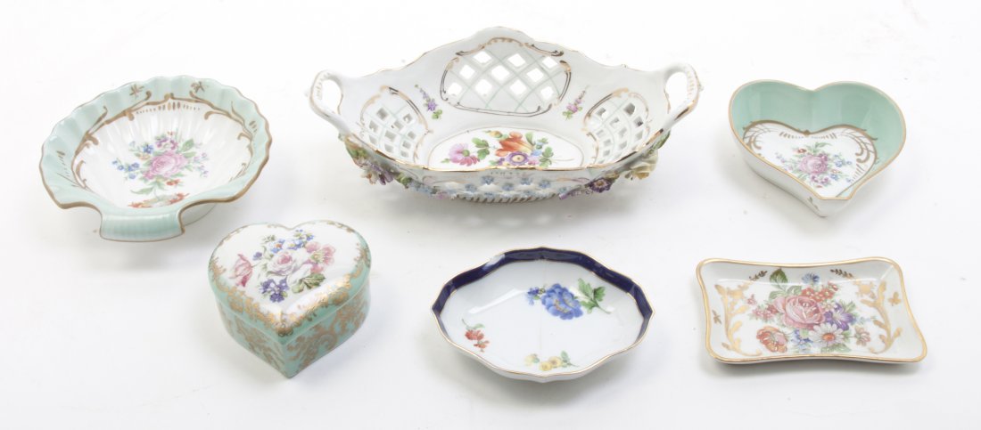 A Collection of Continental Porcelain Table Articles, W: A Collection of Continental Porcelain Table Articles, comprising German and French examples, including trays, a basket, a box and others. Width of widest 9 inches.