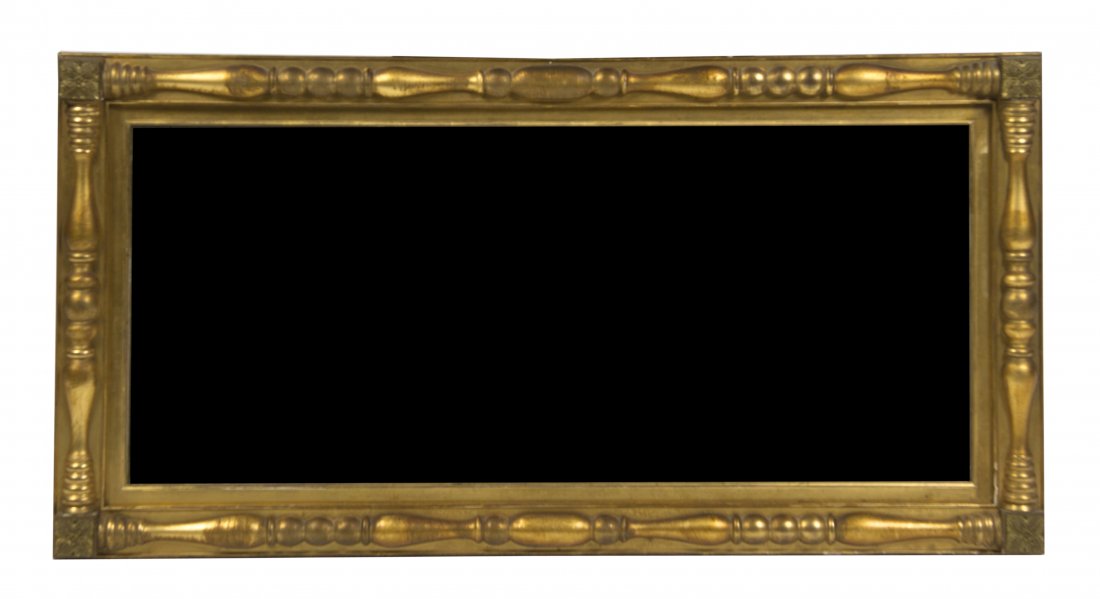 An American Classical Giltwood Mirror, Width 47 7/8 inc: An American Classical Giltwood Mirror, of rectangular form having turned engaged half column decoration with rosettes to each corner, set with a conforming plate. Width 47 7/8 inches. Property from th