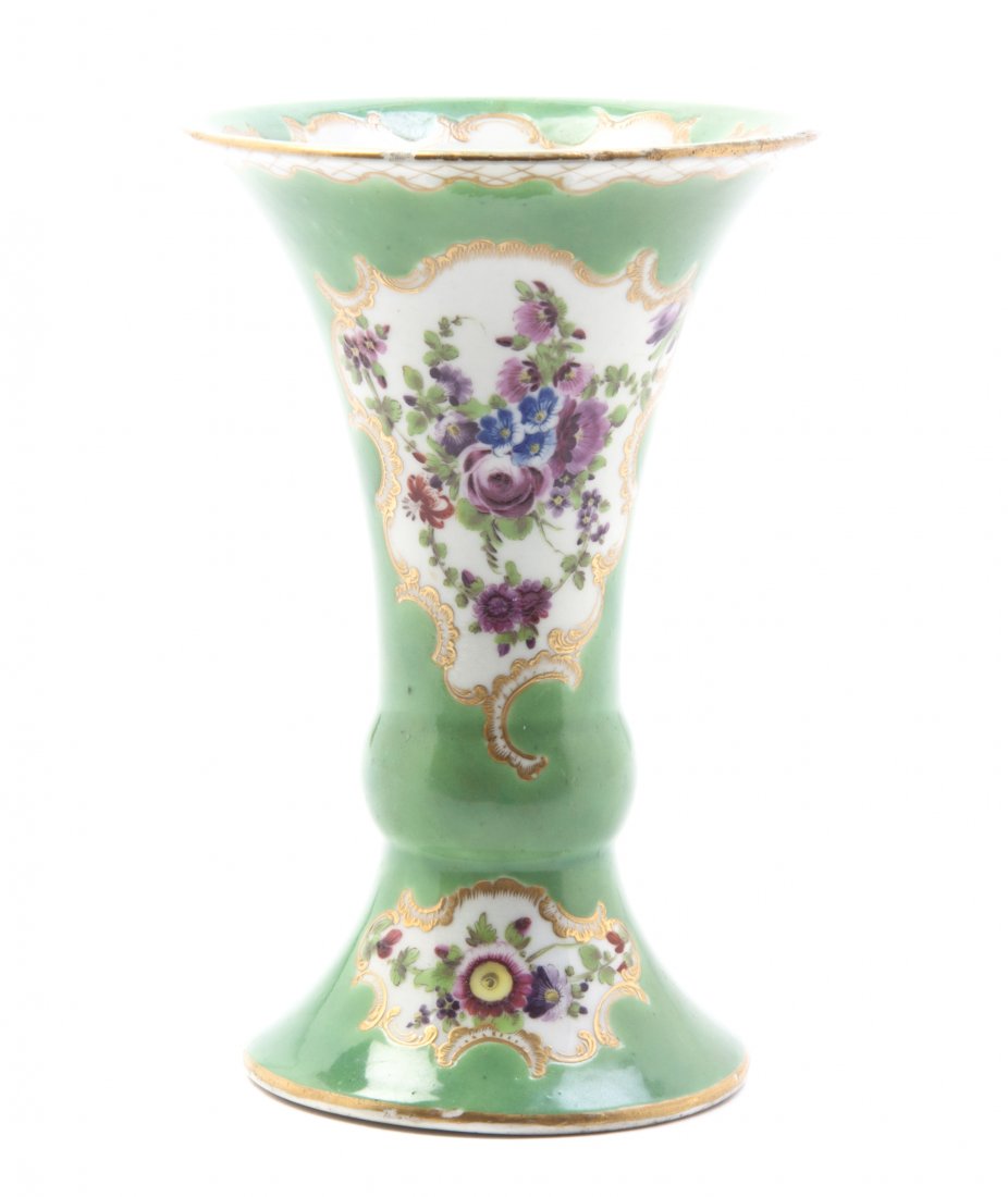 A Royal Worcester Porcelain Vase, Height 5 1/2 inches.: A Royal Worcester Porcelain Vase, circa 1760, of gu form, with painted floral decoration on a green ground and having gilt accents throughout. Height 5 1/2 inches. Property from the Estate of a Florid