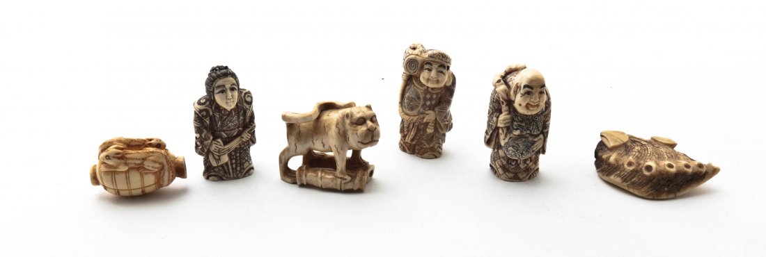 A Group of Six Japanese Ivory Netsuke, Height of talles: A Group of Six Japanese Ivory Netsuke, comprising three figures, one modeled after an abalone shell, a cat standing on a bamboo segment and two squirrels on a lantern. Height of tallest 2 inches.