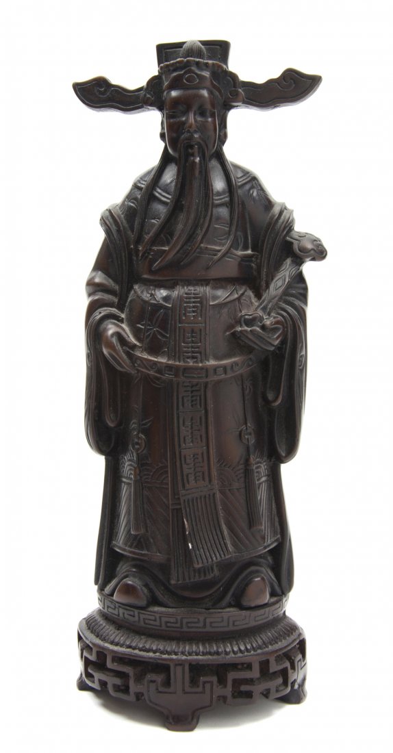 A Chinese Cast Metal Figure, Height 11 inches.: A Chinese Cast Metal Figure, depicting an emperor in a headdress with a long beard, holding a ruyi scepter, on a key-fret bordered base, further raised on a pierced base. Height 11 inches.
