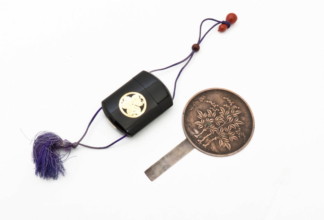 A Japanese Composite Inro, Length of mirror 5 5/8 inche: A Japanese Composite Inro, having gilt mon decoration and a double gourd form netsuke, together with a small Japanese bronze mirror. Length of mirror 5 5/8 inches.