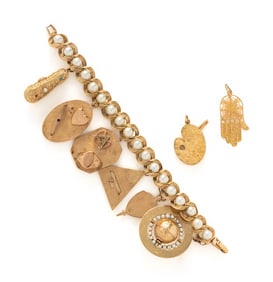 YELLOW GOLD CHARM BRACELET AND TWO CHARMS