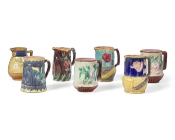 A Collection of Seven Majolica Pitchers