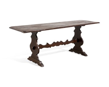 A Baroque Style Stained Fruitwood Trestle Table