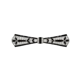 TIFFANY & CO., ART DECO, PLATINUM, DIAMOND, AND ONYX BOW BROOCH