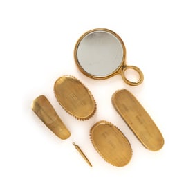 CARTIER, YELLOW GOLD DRESSER SET