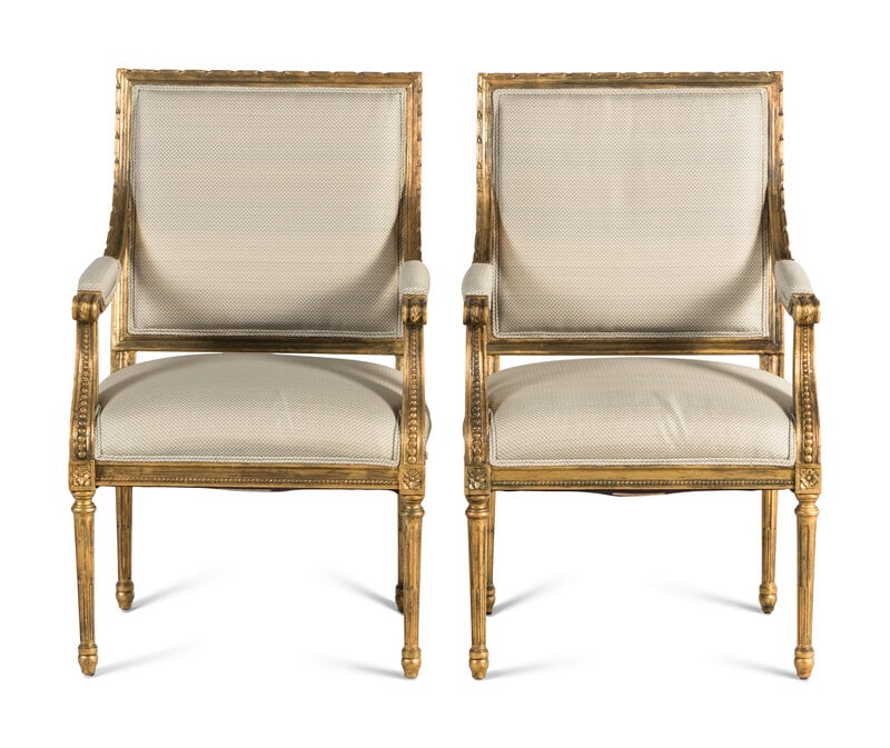 A Pair of Louis XVI Style Giltwood Fauteuils : A Pair of Louis XVI Style Giltwood Fauteuils 20th Century each labeled for Trouvailles Inc., Watertown, Massachusetts to underside. Height 39 x width 24 x depth 21 inches.