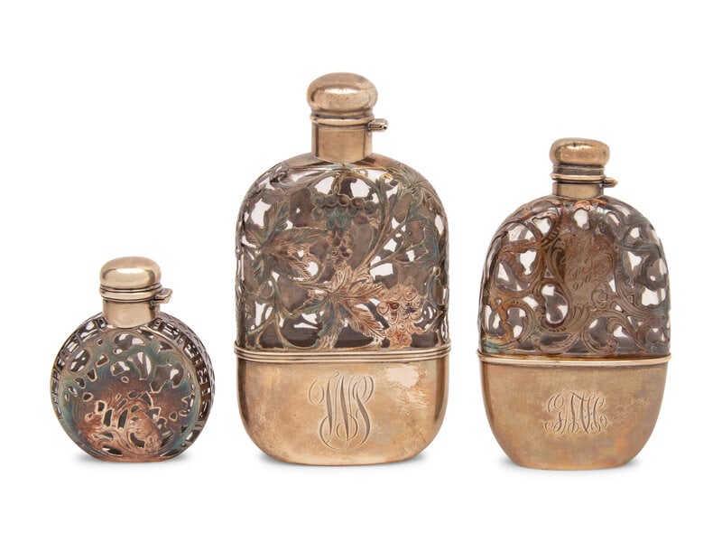 A Group of Three American Silver Overlay Flasks: A Group of Three American Silver Overlay Flasks 20th Century the largest stamped STERLING to underside and monogrammed WS, the second largest stamped STERLING, monogrammed GMH and in