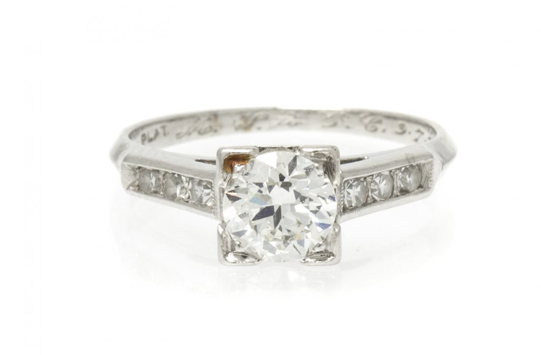 A Platinum and Solitaire Diamond Ring, 2.10 dwts.: A Platinum and Solitaire Diamond Ring, containing one transitional brilliant cut diamond weighing approximately 0.68 carat and six single cut diamonds weighing approximately 0.15 carat total. Stamp: P