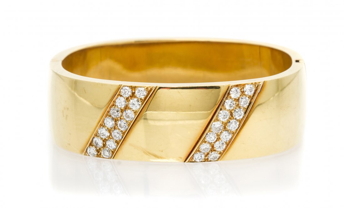 An 18 Karat Yellow Gold and Diamond Bangle Bracelet, 44: An 18 Karat Yellow Gold and Diamond Bangle Bracelet, measuring approximately 20.20 mm wide, containing 28 old European cut diamonds weighing approximately 2.50 carats total. Stamp: FATTO A MANO 750 RO