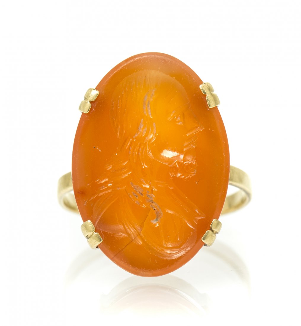 A 14 Karat Yellow Gold and Sardonyx Intaglio Ring, 4.00: A 14 Karat Yellow Gold and Sardonyx Intaglio Ring, containing one oval sardonyx intaglio depicting a classically dressed male profile. 4.00 dwts.