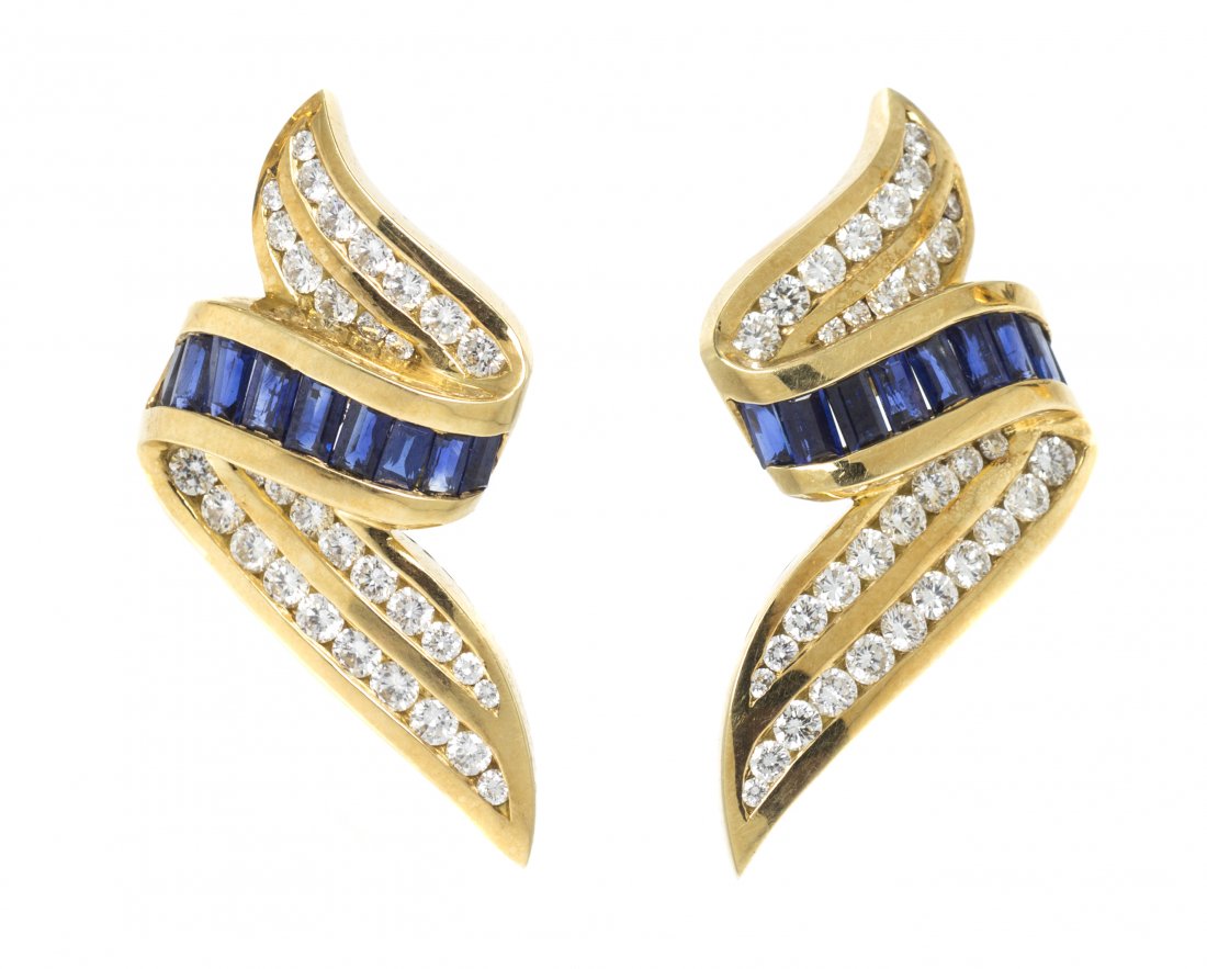 A Pair of 18 Karat Yellow Gold, Diamond and Sapphire Ea: A Pair of 18 Karat Yellow Gold, Diamond and Sapphire Earrings, Charles Krypell, in a ribbon design, containing numerous round brilliant cut diamonds weighing approximately 1.50 carats total and 18 bag