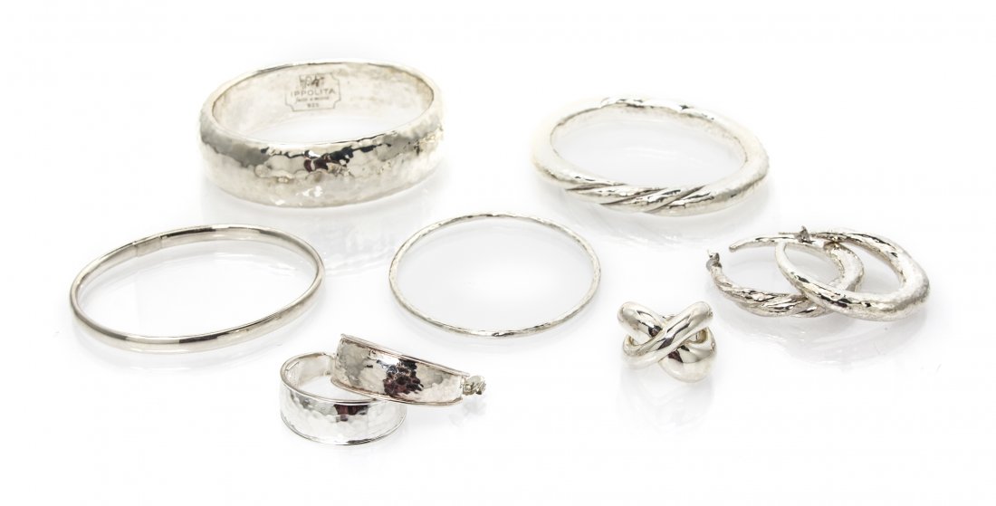 A Collection of Sterling Silver Jewelry, Ippolita, 105.: A Collection of Sterling Silver Jewelry, Ippolita, four bangle bracelets, two pairs of earrings and a ring with hammered textured design. Stamp: IPPOLITA FATTO A MANO 925. 105.60 dwts. Property from t
