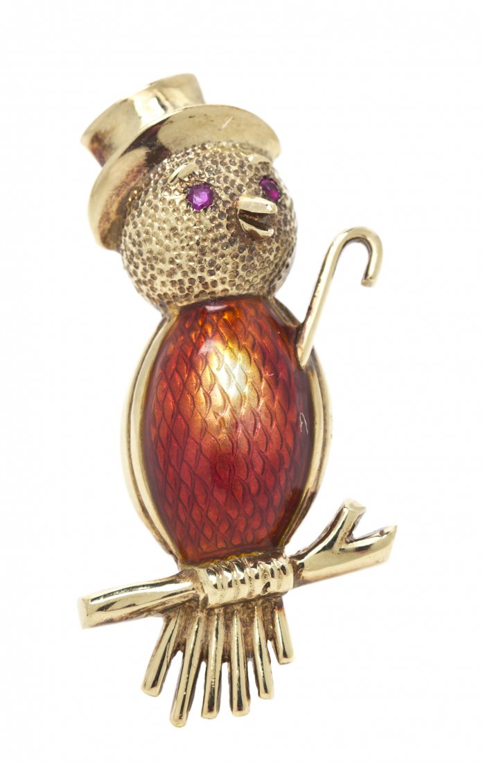 A 14 Karat Yellow Gold, Ruby and Enamel Bird Brooch, 6.: A 14 Karat Yellow Gold, Ruby and Enamel Bird Brooch, depicting a stylized perched bird with a cane and top hat, containing two round brilliant cut ruby eyes and accented at the breast with translucent