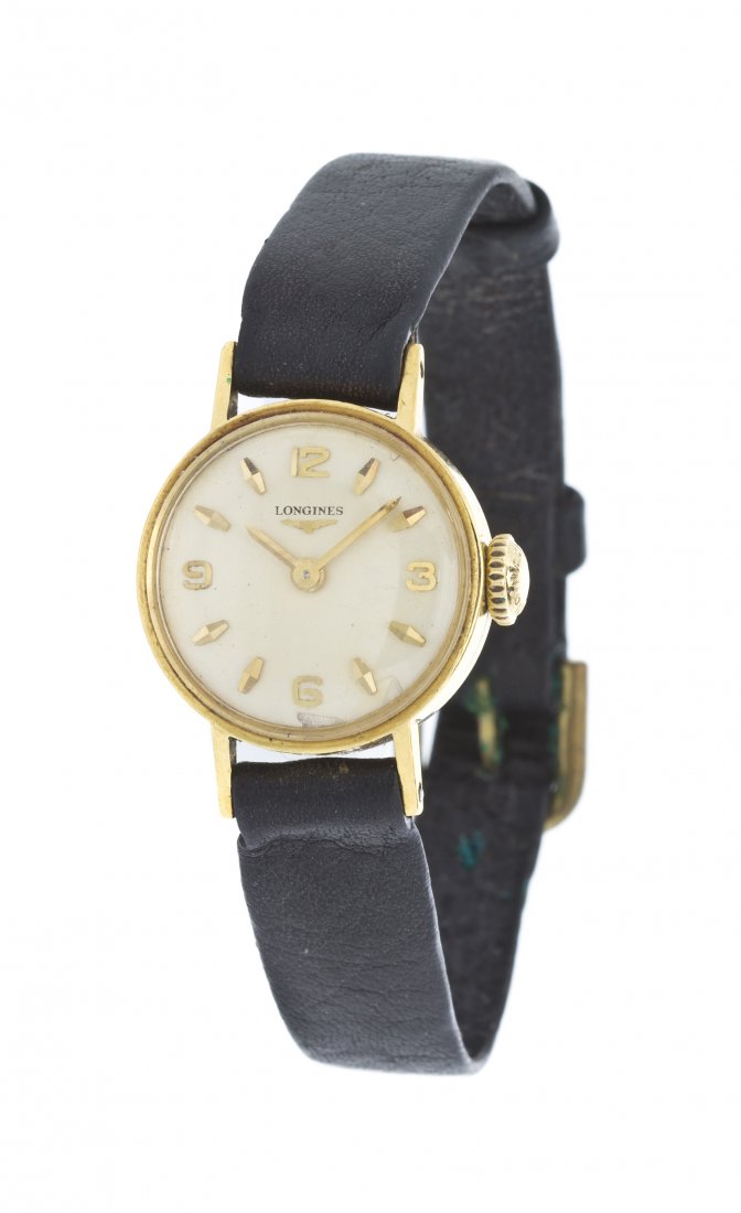 A Yellow Gold Wristwatch, Longines,: A Yellow Gold Wristwatch, Longines, 19.00 MM case diameter, matte silver case, applied gold index and Arabic numerals, gold baton hands, snap on case back, hand wound mechanical movement, leather stra