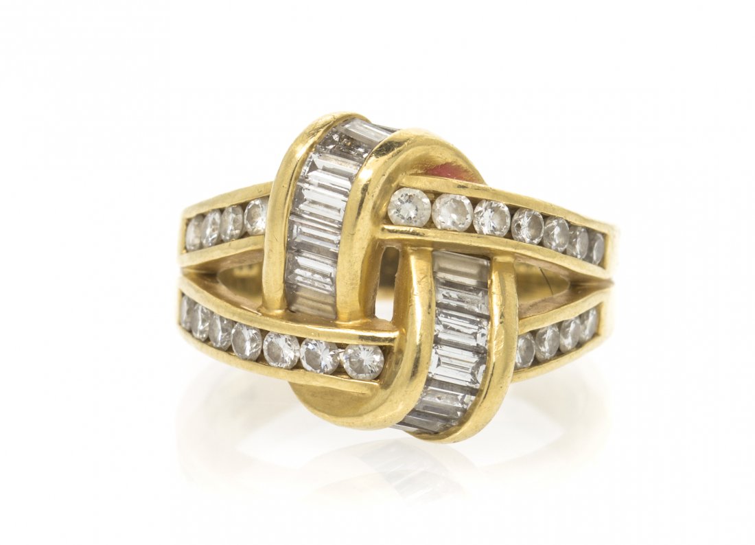 An 18 Karat Yellow Gold and Diamond Ring, Charles Krype: An 18 Karat Yellow Gold and Diamond Ring, Charles Krypell, in a woven knot design, containing numerous round brilliant cut diamonds weighing approximately 0.66 carat total and 16 baguette cut diamonds