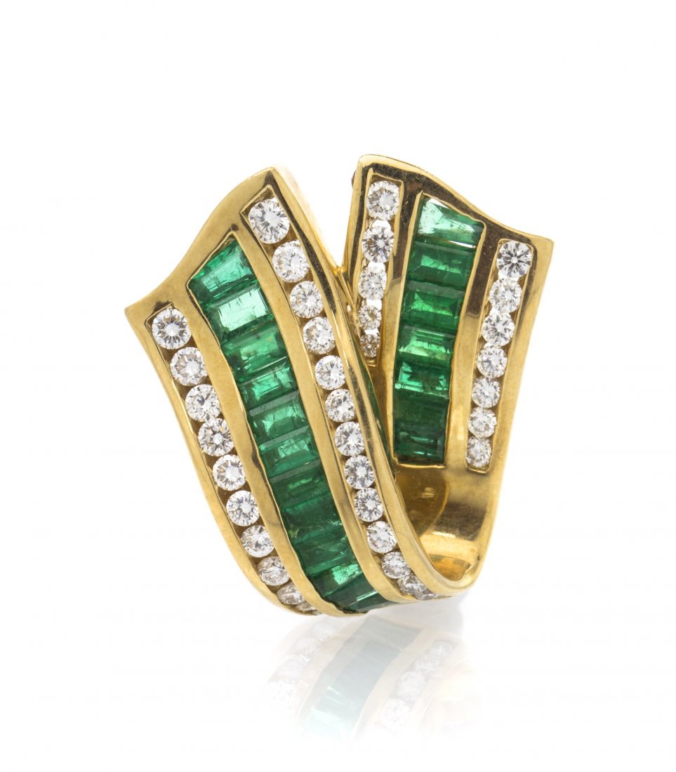 An 18 Karat Yellow Gold, Diamond and Emerald Enhancer P: An 18 Karat Yellow Gold, Diamond and Emerald Enhancer Pendant, Charles Krypell, in a ribbon design, containing numerous round brilliant cut diamonds weighing approximately 0.70 carat total and 20 bagu