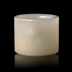 A Chinese Incised White Jade 'Poem' Archer's Ring, 18th/19th Century 清中晚&#26399