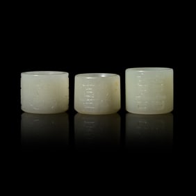 Three Chinese White Jade 'Double Happiness' Archer’s Rings, 19th Century 清晚
