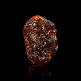 A Chinese Carved 'Bats and Shou-Lao' Amber Pendant, 18th-19th Century 清中期