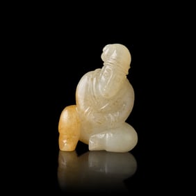 A Chinese Russet and White Jade Carved Foreigner  白玉帶沁胡人