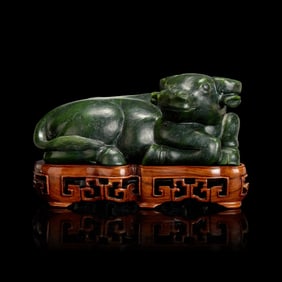 A Chinese Spinach Jade Buffalo, Qing Dynasty 清 青玉臥牛