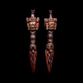 A Pair of Sino-Tibetan Gilt and Red Decorated Wood Vajries, possibly Zitan, 18th-19th Century