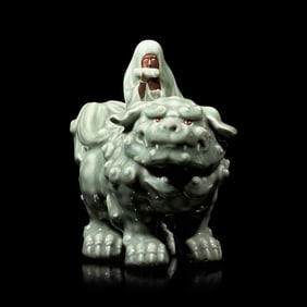 A Japanese Celadon-Glazed Monju on Lion, Impressed Seal Makuzu