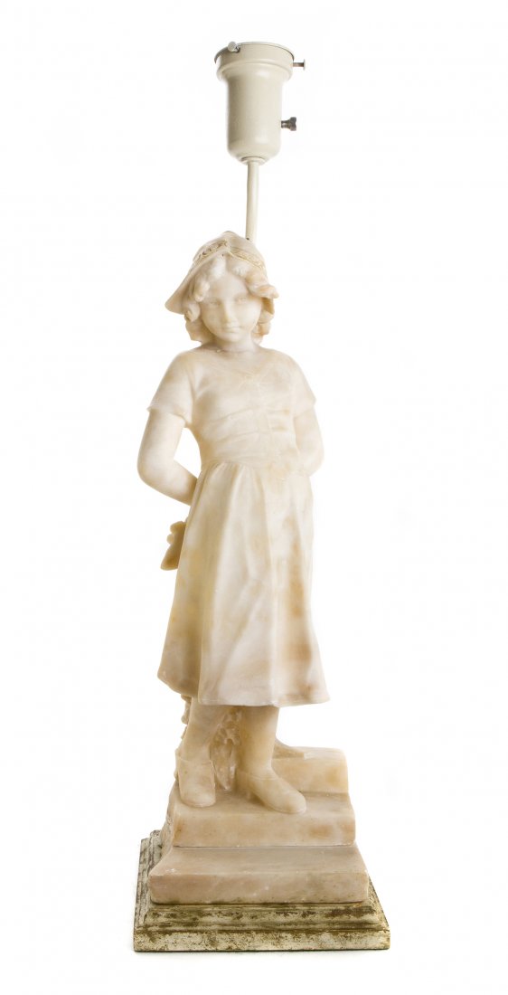 An Alabaster Carved Figure of a Girl, Height 20 1/2 inc: An Alabaster Carved Figure of a Girl, depicted in Dutch style dress, standing at the top of stairs, raised on a rectangular base and mounted as a lamp. Height 20 1/2 inches. Property from the SJR Trus