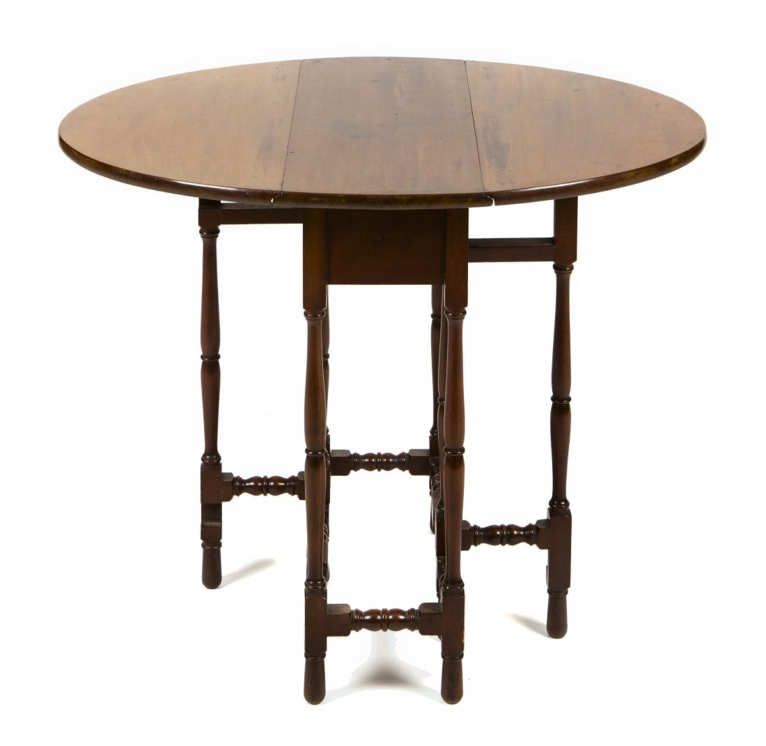 A Spider Leg Mahogany Drop-Leaf Table, Height 28 x widt: A Spider Leg Mahogany Drop-Leaf Table, having a rectangular top with D-shaped drop leaves raised on tapering turned legs joined by stretchers. Height 28 x width 34 1/4 x depth 26 1/2 inches. Property