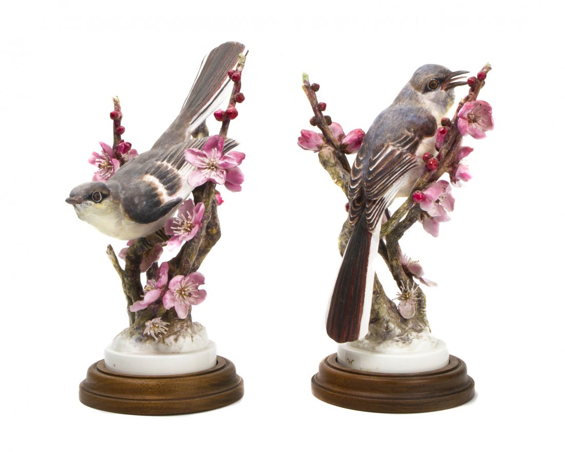 A Pair of Royal Worcester Dorothy Doughty Birds, Mockin: A Pair of Royal Worcester Dorothy Doughty Birds, Mockingbirds, perched on apple blossom branches. Height 10 3/4 inches. Property from the Estate of Barbara Archer Thomas, Naples, Florida
