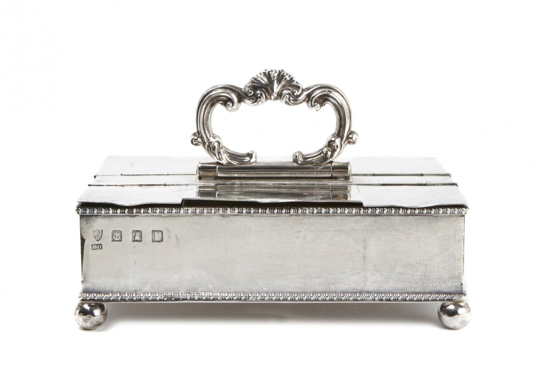 A George V Britannia Silver Ink Stand, Ellis Jacob Gree: A George V Britannia Silver Ink Stand, Ellis Jacob Greenberg, Birmingham, 1916, of rectangular form with gadrooned borders having hinged lids opening to a fitted interior, one side having two glass in