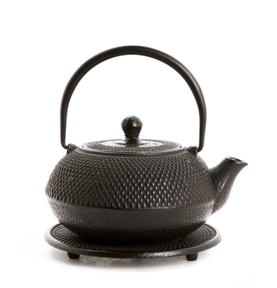 A Japanese Cast Iron Teapot and Trivet. Height 6 1/4 in: A Japanese Cast Iron Teapot and Trivet. Height 6 1/4 inches.