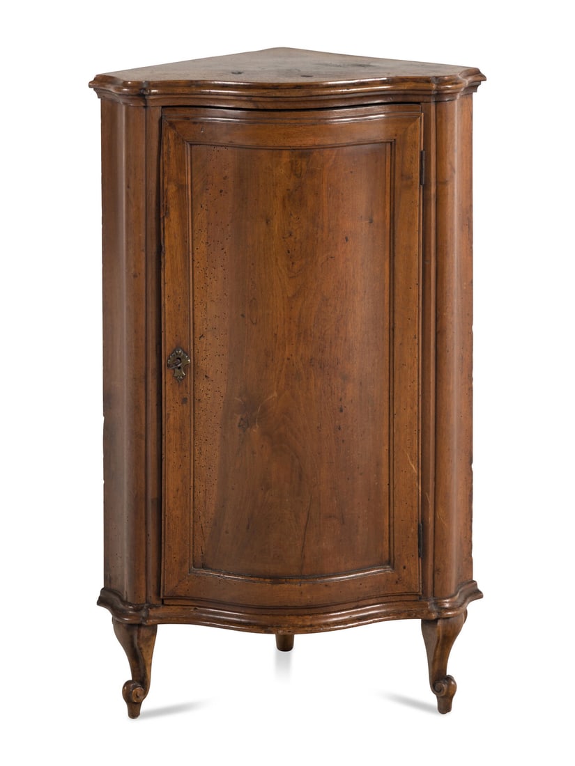 A French Walnut Encoignure: A French Walnut Encoignure First Half 19th Century Height 38 1/2 x width 24 x depth 17 inches. This lot is located in Chicago.