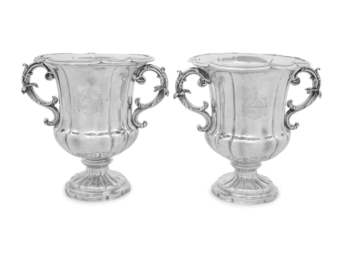 A Pair of English Silver-Plate Wine Coolers: A Pair of English Silver-Plate Wine Coolers Creswick and Compnay, Sheffield, 19th Century each engraved with a shield crest. Height 11 1/4 inches. This lot is located in Chicago.