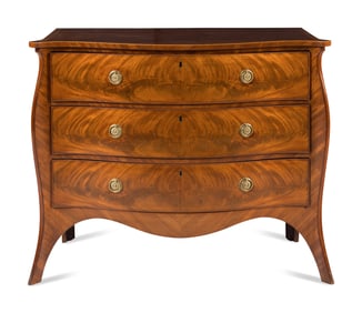 A George III Mahogany Serpentine Commode