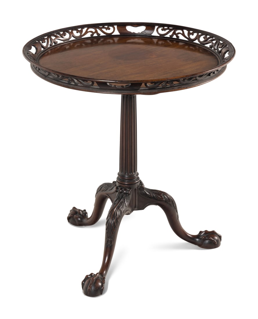 A George II Mahogany Tilt-Top Tripod Table: A George II Mahogany Tilt-Top Tripod Table Circa 1755 with repairs to the fretwork border. Height 28 3/4 x diameter of top 26 1/2 inches. This lot is located in Chicago. Provenance: Frank Partridge, L