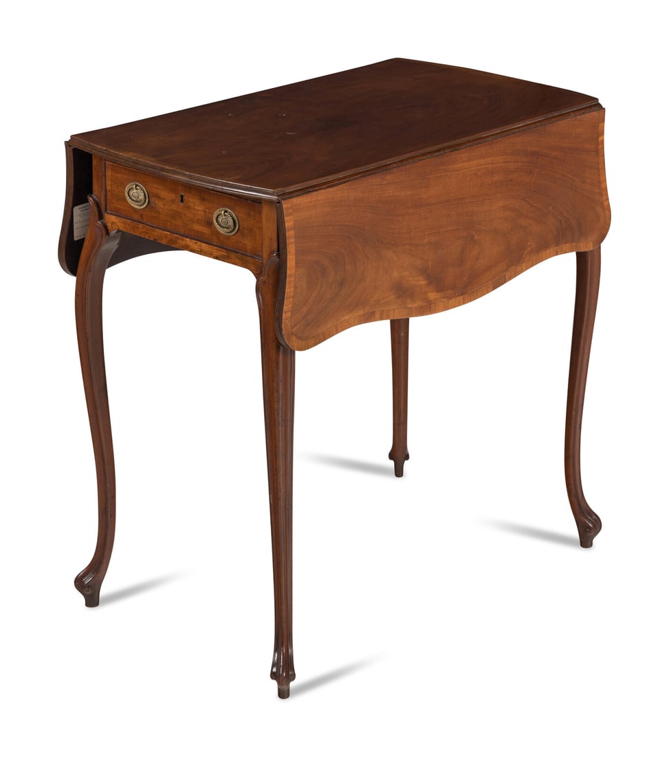 A George III Mahogany and Satinwood Pembroke Table: A George III Mahogany and Satinwood Pembroke Table Manner of John Cobb, Circa 1770 with shaped dropleaves surmounting a single drawer and raised on cabriole legs. Height 27 3/4 x width 34 1/2 (open) x
