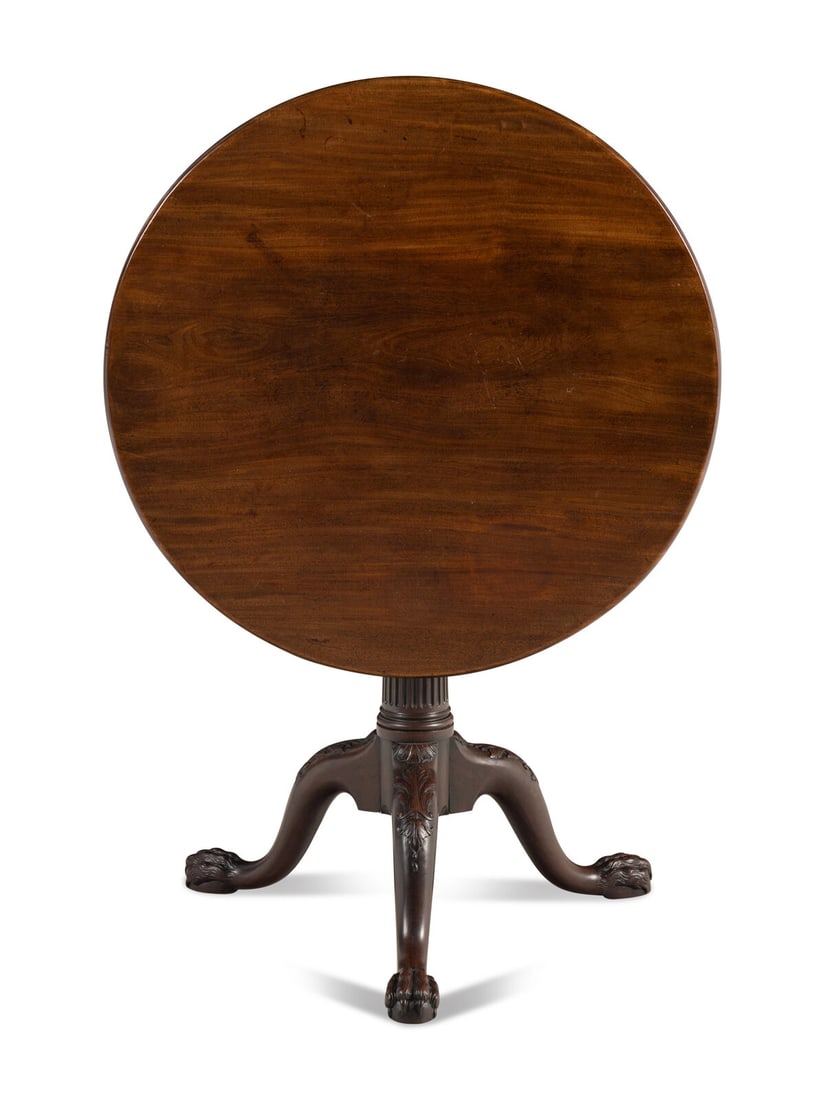 An George III Mahogany Tripod Tea Table: An George III Mahogany Tripod Tea Table Possibly Irish, Circa 1760 the circular top surmounting a birdcage action with a fluted columnar stem issuing three cabriole legs ending in hairy-paw feet. Heig