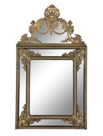 A Louis XIV Style Gilt Bronze Mounted and Ebonized Mirror