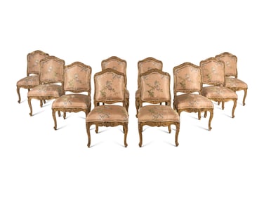 A Set of Ten Régence Style Giltwood Dining Chairs