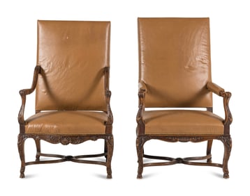 A Matched Pair of Régence Style Walnut Fauteuils