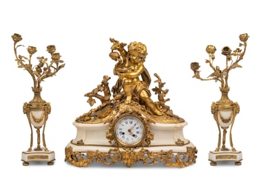 An Assembled French Gilt Bronze Mounted Marble Three-Piece Clock Garniture