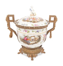 A Continental Gilt Metal Mounted Porcelain Covered Urn