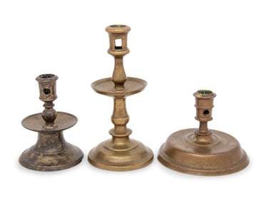 A Group of Three Dutch Brass Candlesticks