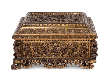 An Italian Parcel Gilt and Carved Walnut Orpheus and Eurydice Casket