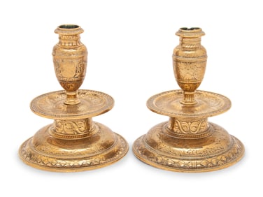 A Pair of Venetian Gilt Bronze Candlesticks