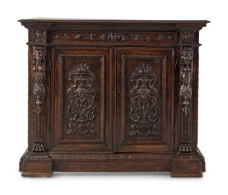 An Italian Baroque Carved Walnut Cabinet