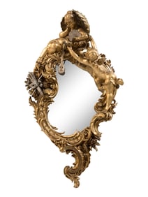 A Baroque Style Gilt and Silvered Composition Mirror